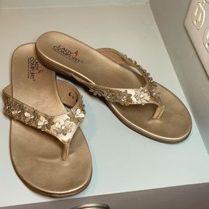Glam gold flip flops with floral accents